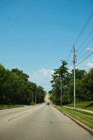 Iowan road. Blue skies inbetween today