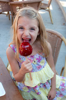 Sara having her first candied apple ever